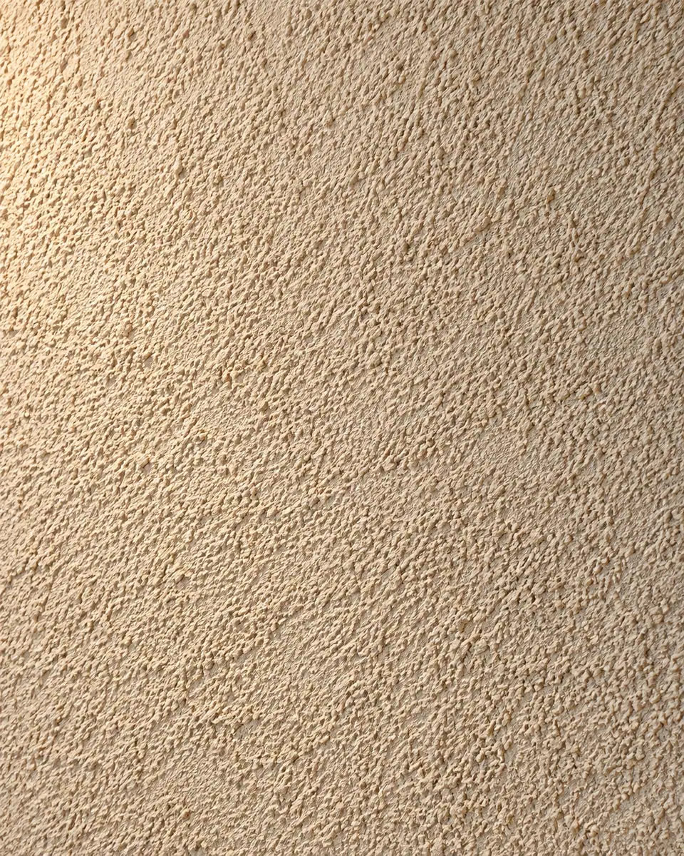 Close de parede com acabamento arenato de textura mineral em tom areia